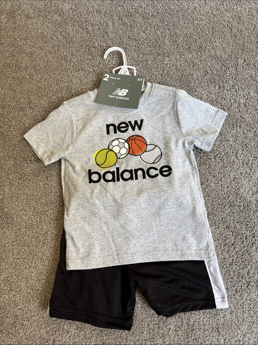 New Balance Grey Tee with Multicolor Sports Ball Graphics